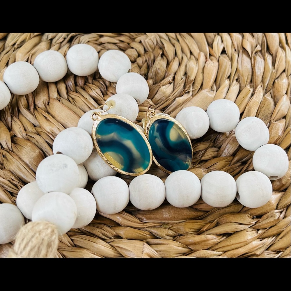 Earrings multi-color oval with gold trim.
